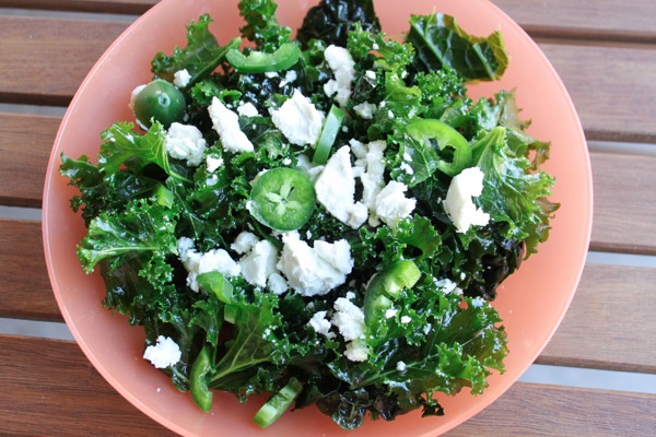 massaged kale salad mountain with goat cheese and jalapeños 